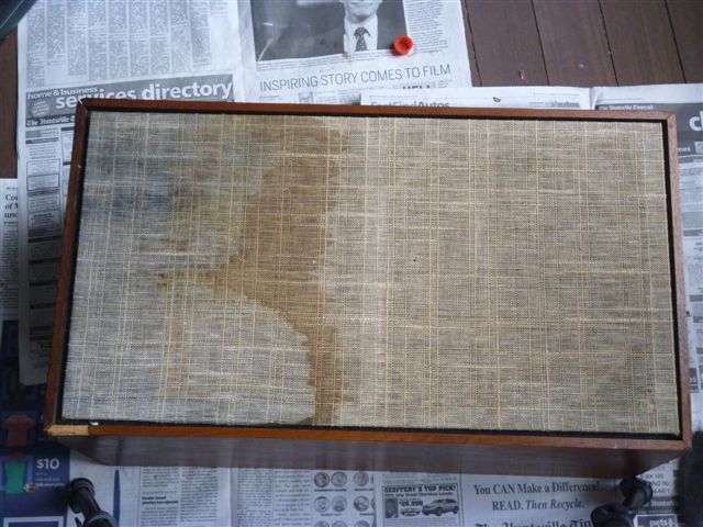 Side of a speaker cabinet before restoration